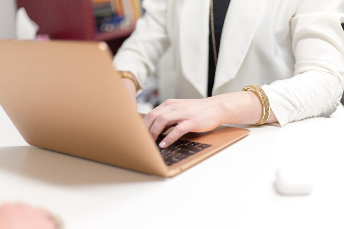 A professional reviewing career options while working at a laptop